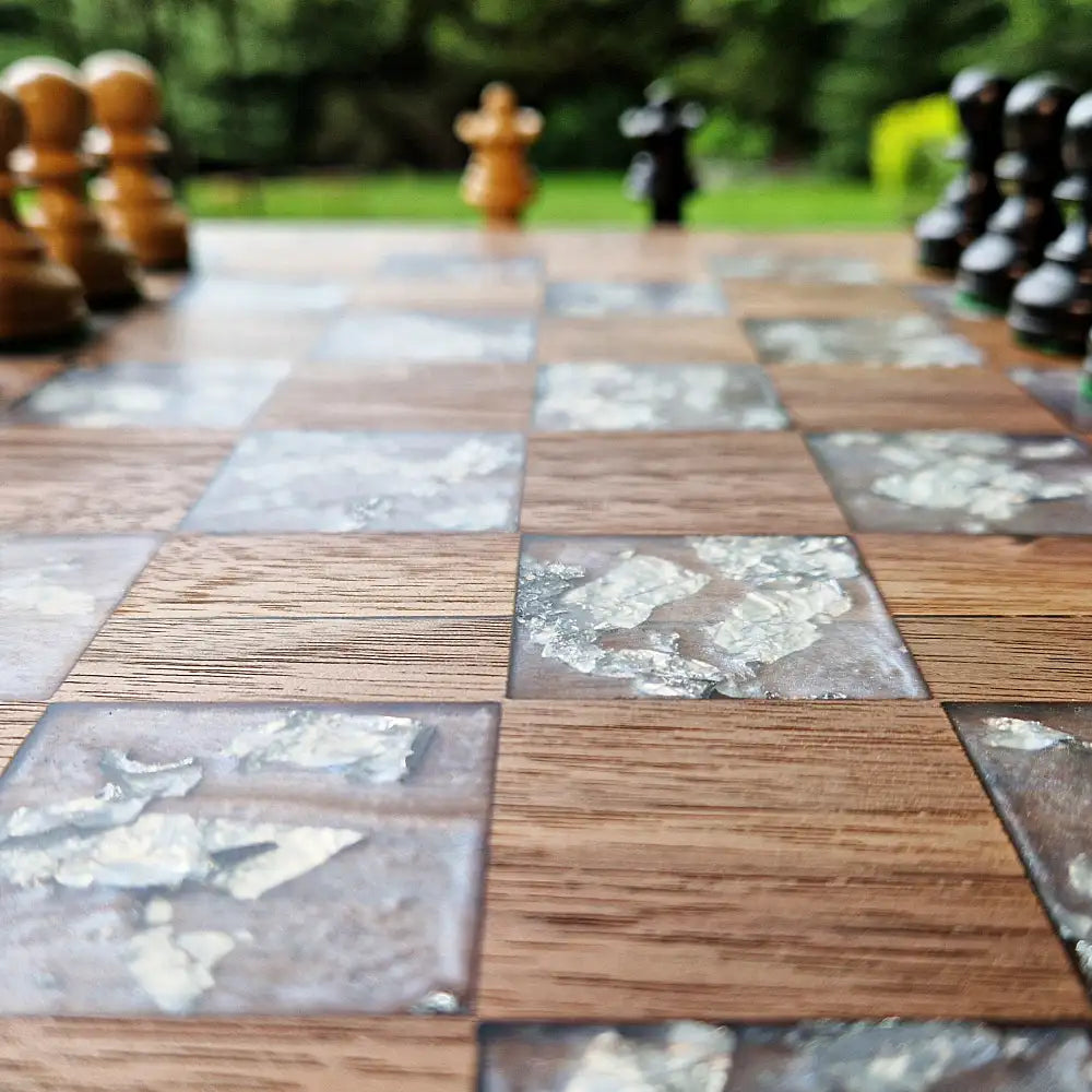 Handcrafted American walnut chessboard with resin and silver leaf. Size: 40x40 cm