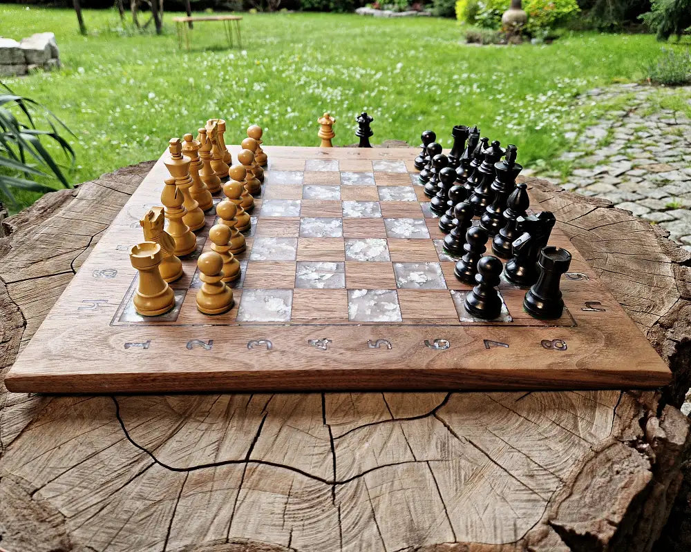 Handcrafted American walnut chessboard with resin and silver leaf. Size: 40x40 cm