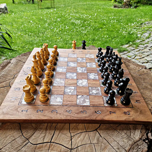 Handcrafted American walnut chessboard with resin and silver leaf. Size: 40x40 cm