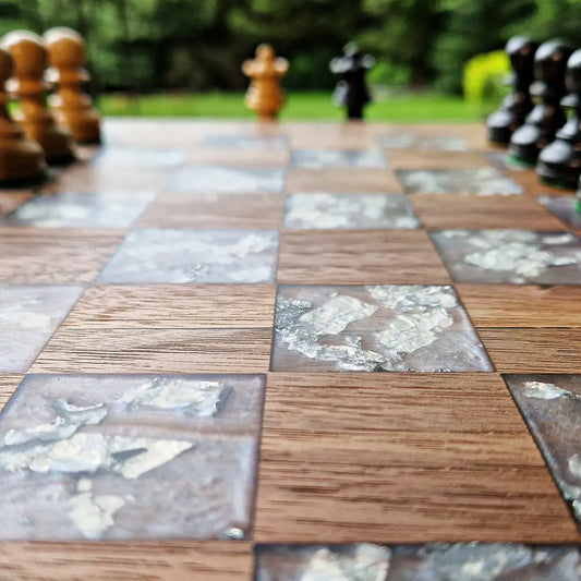 Handcrafted American walnut chessboard with resin and silver leaf. Size: 40x40 cm