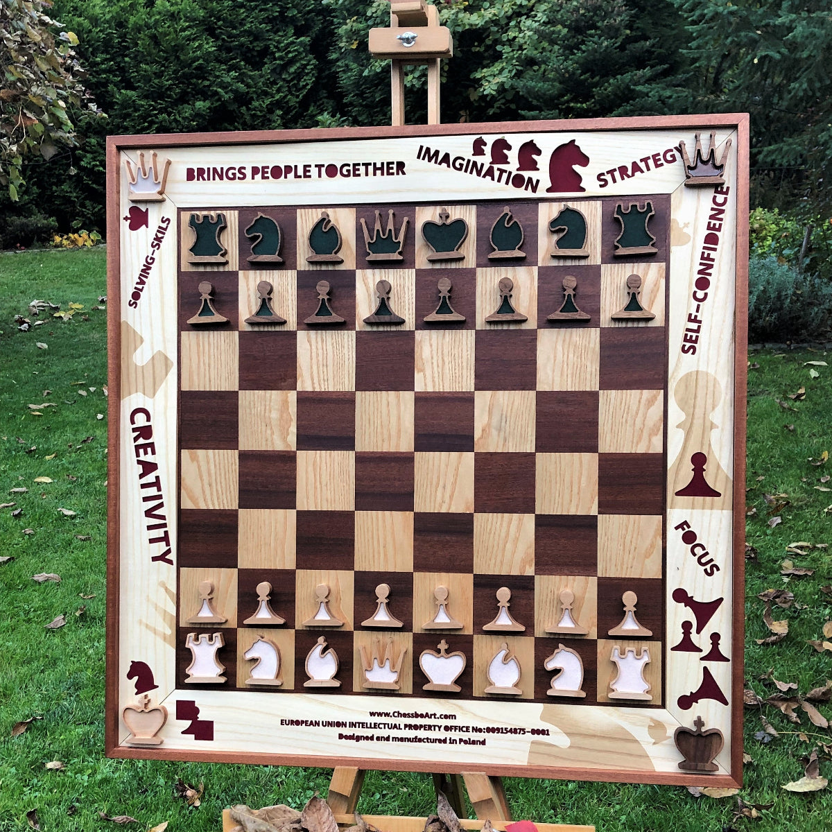Creative and colorfull vertical chess set in autumn garden