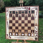 Creative and colorfull vertical chess set in autumn garden